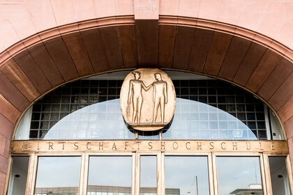 Door arch with golden decorations, BWL entrance